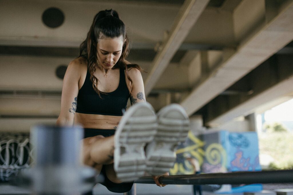 Woman doing strength training workout outdoors - fitness, weight loss, and muscle building exercise